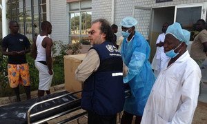 WHO delivers disposable personal protection equipment to isolation ward at the China-Guinea Friendship Hospital in Conakry, Guinea.