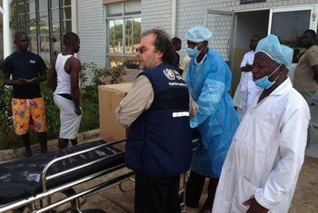 WHO delivers disposable personal protection equipment to isolation ward at the China-Guinea Friendship Hospital in Conakry, Guinea.