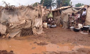 Water stagnates amidst tents and shelters following early-season rainfalls at the displacement site at Bangui's international airport in the Central African Republic.