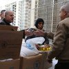 Syrians receiving WFP rations.