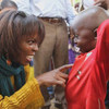 WFP Executive Director Ertharin Cousin speaks to a little boy in the Central African Republic during her visit in late March 2014.