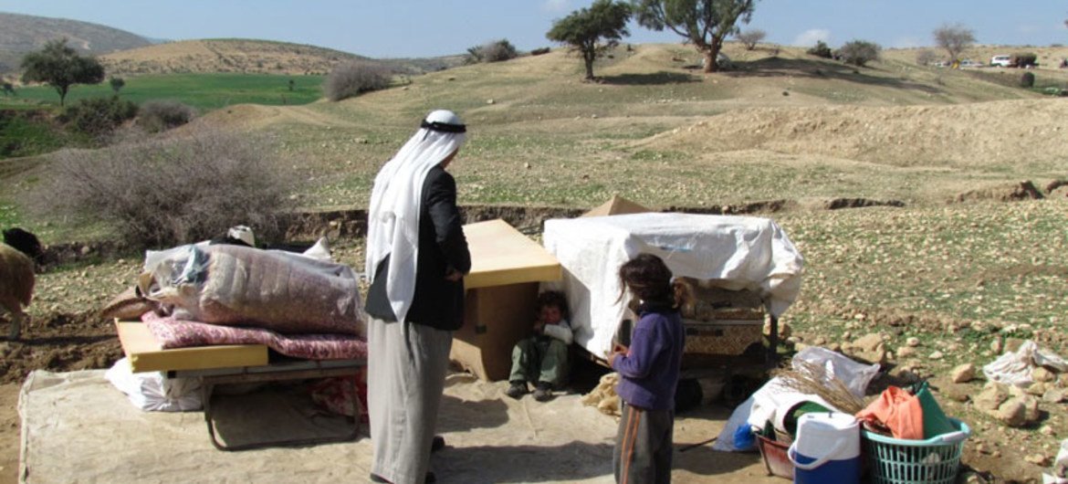 Displaced Palestinians with their belongings, following Israeli authorities demolition of their structures in Ein al Hilwa (Tubas Governorate) in the Jordan Valley on 30 January 2014.