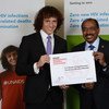 UNAIDS Executive Director Michel Sidibé (right) with new International Goodwill Ambassador, Brazilian football star David Luiz.