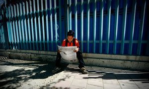 Young Timorese Reads Local Newspaper