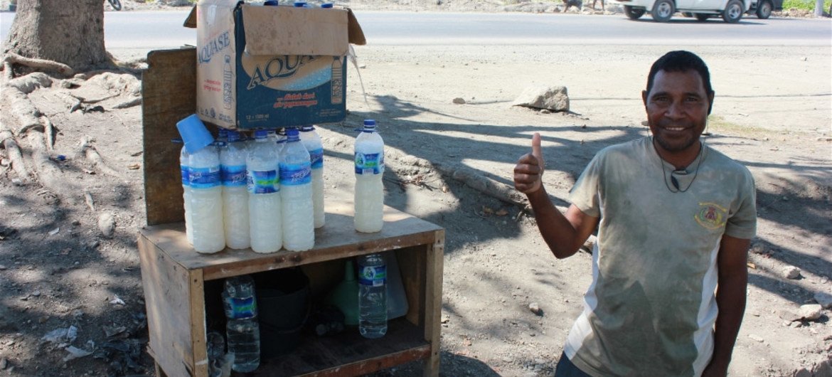 Local palm wine, tua mutin, sold along roadside in Timor-Leste. WHO is urging greater national action to curb alcohol-related deaths and diseases.