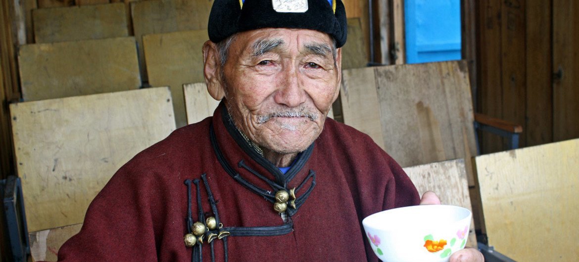 An elderly Mongolian herder drinks fermented mare’s milk in Ulaanbaatar.