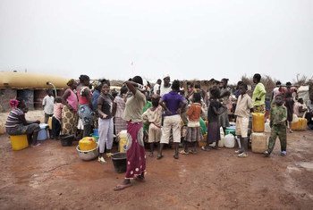 Internally displaced Central Africans gather to collect water. The needs of the newly displaced are great.