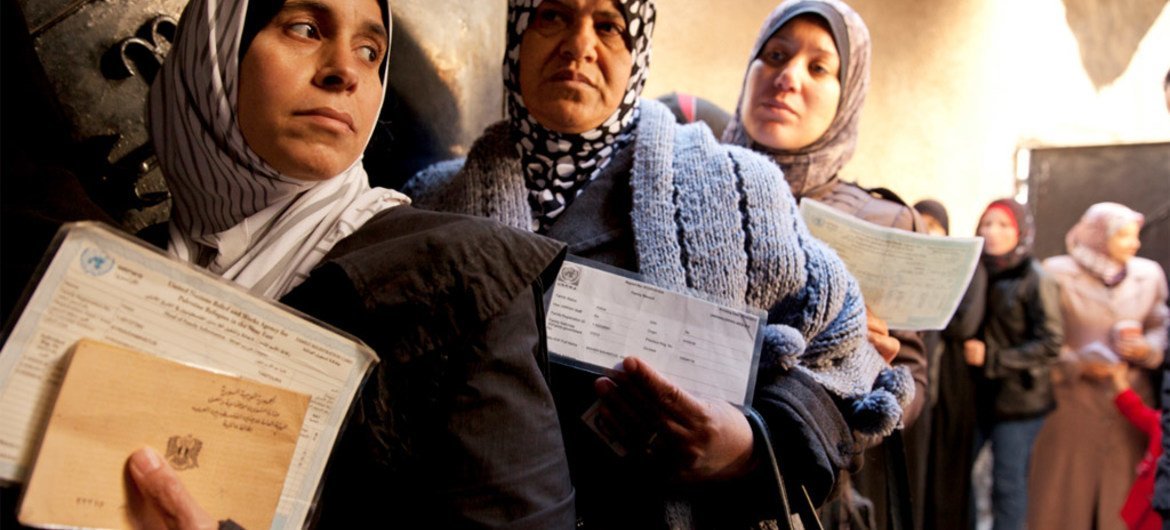 Palestinian women at a UNRWA distribution centre in the Jaramana refugee camp, Damascus, Syria.