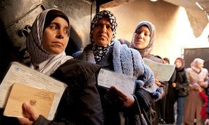 Palestinian women at a UNRWA distribution centre in the Jaramana refugee camp, Damascus, Syria.