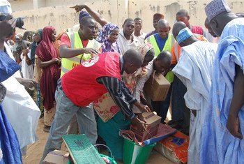 Aid agencies hand out relief to people displaced by Boko Haram.
