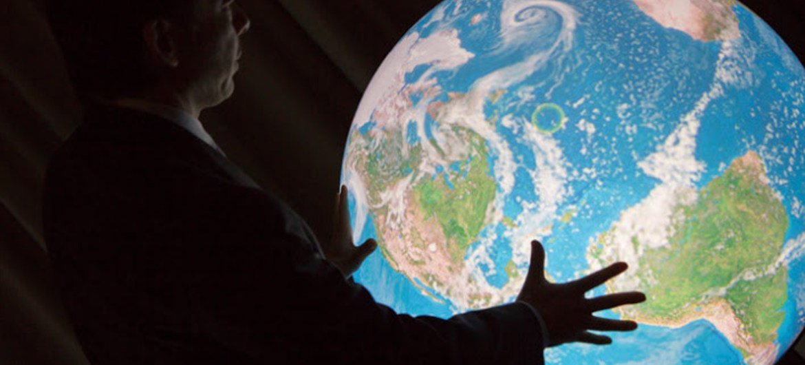 Professor Shinichi Takemura demonstrates the Tangible Earth interactive digital globe at R!SE launch.