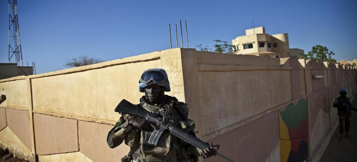 UN peacekeepers from Togo patrol the perimeter of the Governor's building after taking over the premises in Kidal, Mali.