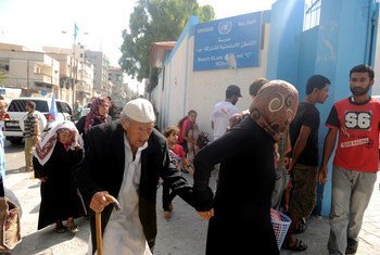 Palestinian families travel to a UNRWA school to seek shelter after evacuating their homes near the border in Gaza City.