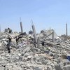 Palestinians search the rubble of destroyed homes in Khuzaa, east of Khan Younis, Gaza Strip.
