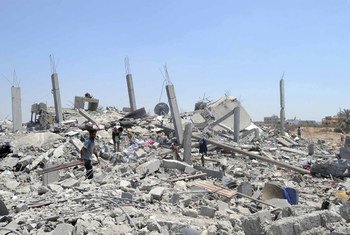 Palestinians search the rubble of destroyed homes in Khuzaa, east of Khan Younis, Gaza Strip.
