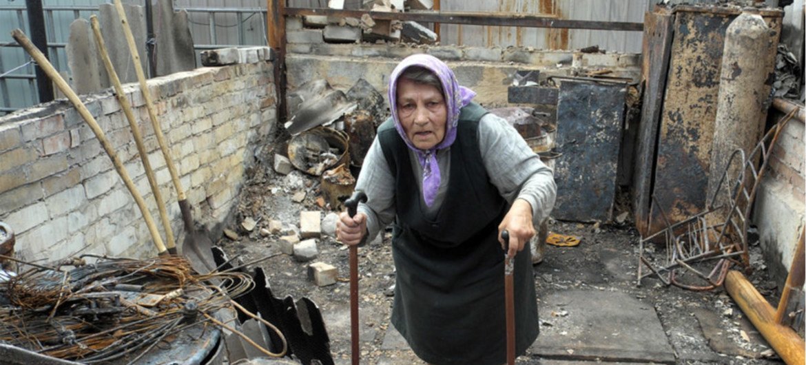 A resident of the Artema suburb of Sloviansk, Ukraine, in the rubble of what used to be her summer kitchen, in July 2014.