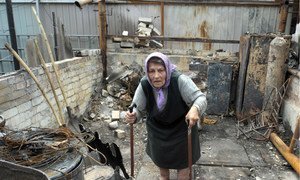 A resident of the Artema suburb of Sloviansk, Ukraine, in the rubble of what used to be her summer kitchen, in July 2014.