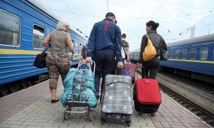 A Ukrainian family with their belongings after arriving at Kyiv by train. They had fled the violence in eastern Ukraine.
