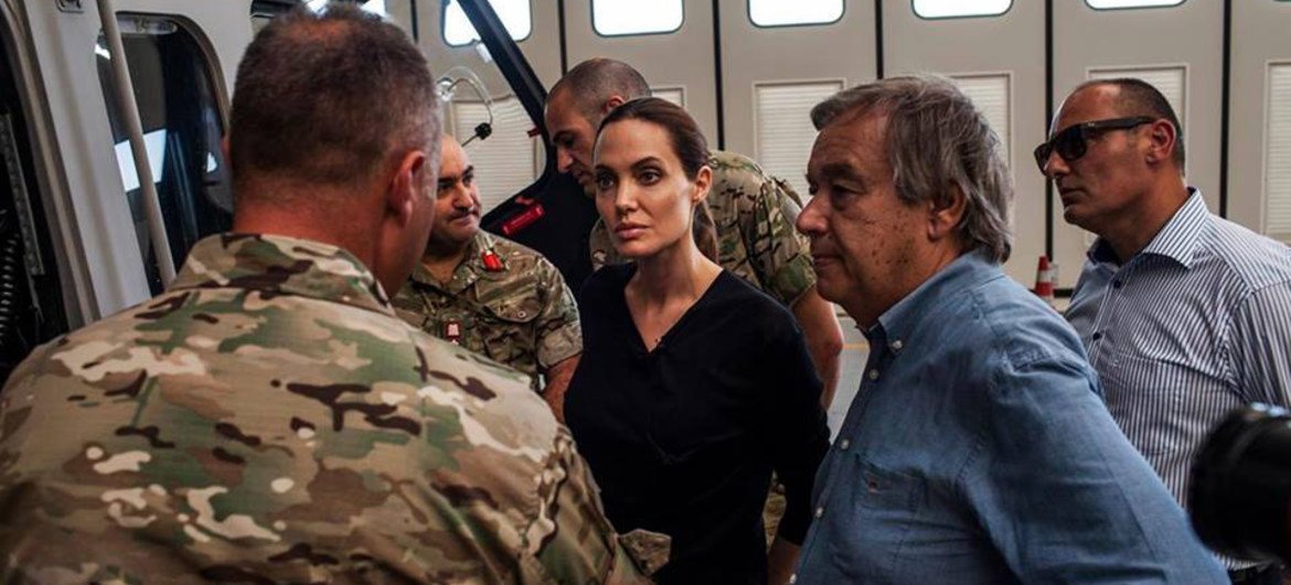 UN High Commissioner for Refugees António Guterres (right) and Special Envoy Angelina Jolie (centre) listening to those involved in rescuing refugees in sea operations in Malta.