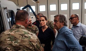 UN High Commissioner for Refugees António Guterres (right) and Special Envoy Angelina Jolie (centre) listening to those involved in rescuing refugees in sea operations in Malta.