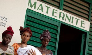 Women and their babies outside the maternity ward of Kissidougou Hospital in the south-eastern Forestière Region of Guinea.