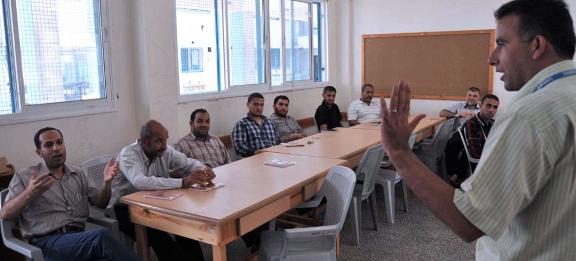 Counsellors from the UNRWA Community Mental Health Programme train a group of teachers in Gaza on how to provide psychosocial support to children and emotional release techniques.