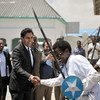 On a visit to Somalia, the Secretary-General's Envoy on Youth, Ahmed Alhendawi (second left), is greeted at the Ministry of Youth by dancers in Mogadishu.