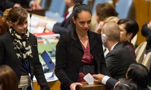 Conference officers collect ballots from delegations during the elections.