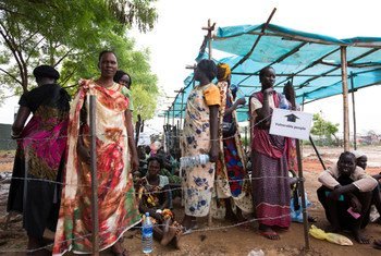 Internally displaced people queue up at a food distribution center in Juba, South Sudan.