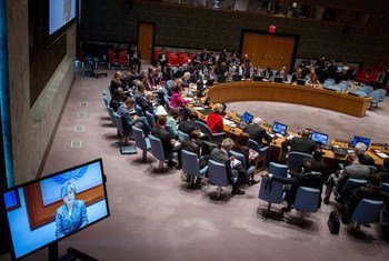 Assistant Secretary-General for Humanitarian Affairs and Deputy Emergency Relief Coordinator, Kyung-wha Kang (reflected on screen), addresses the Security Council meeting on the situation in the Middle East, via video hook up.