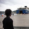 Two young Eritreans wait to board a commercial ferry at Samos Island, Greece. Growing numbers of Eritreans are seeking asylum in Europe.