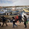 لاجئون على جزيرة لامبيدوزا الايطالية بعد عبور البحر المتوسط على متن قارب. المصدر: المفوضية السامية لشؤون اللاجئين / أف. نوي