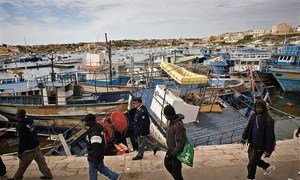 Migrants arriving on Italy’s Lampedusa Island after crossing the Mediterranean on a dilapidated boat.