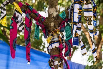 Patients who recover from the Ebola virus disease tie a ribbon to the tree on leaving the Maforki Ebola Treatment Centre in Port Loko, Sierra Leone.