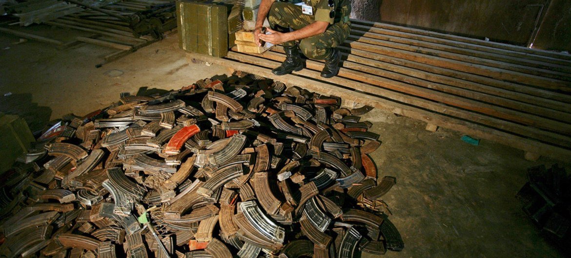 A UN peacekeeper in the Democratic Republic of the Congo (DRC) examines AK-47 magazines stored in a warehouse in Beni after they have been collected in the demobilization process in Matembo, North Kivu.