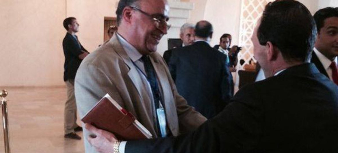 Two parliamentarians from opposing political camps greet each other in Ghadames, Libya, on 29 September 2014.