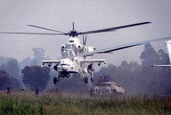 A MONUSCO attack helicopter provides aerial protection for a convoy carrying FDLR ex-combatants from Kanyabayonga transit camp, Democratic Republic of the Congo (DRC).