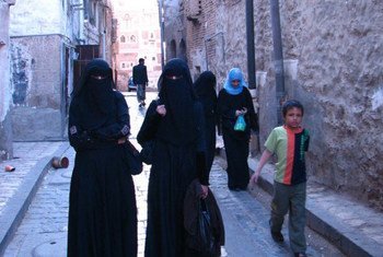 Pedestrians on a street in Sana’a, capital of Yemen.