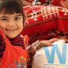 A displaced child in Southern Iraq with UN World Food Programme (WFP) food.