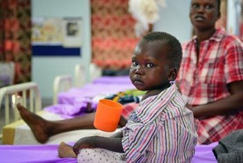 A child sips on therapeutic milk at a hospital in Juba, South Sudan, where nearly one million children are suffering from acute malnutrition.