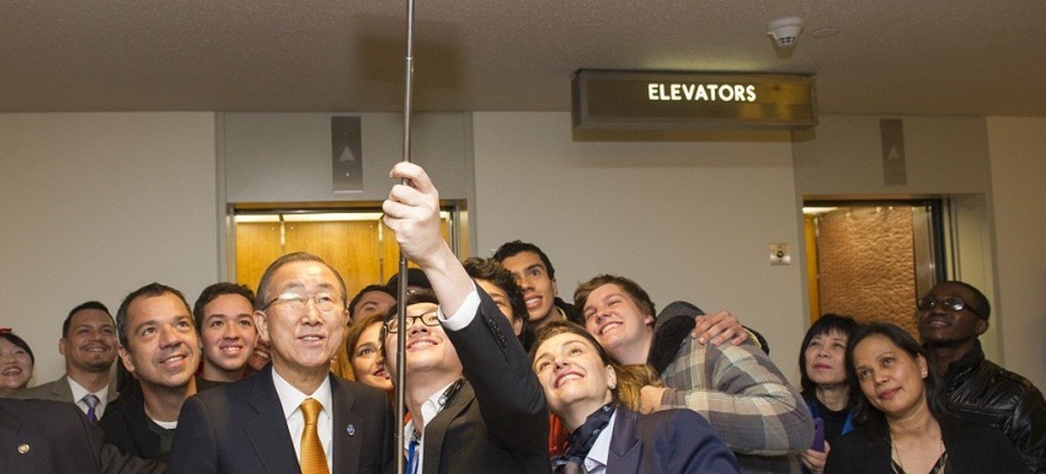 Secretary-General Ban Ki-moon tours reopened visitors' lobby in General Assembly Building. He is seen here posing for a 'selfie' with Brazilian visitors. February 2015 United Nations, New York.