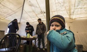 A young displaced Ukrainian boy finds shelter from the cold in a tent in Slovyansk. His family hope to move to Kyiv after leaving the conflict-torn town of Debaltseve.