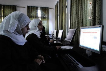 Girls use computers at a school in Sana’a, Yemen.