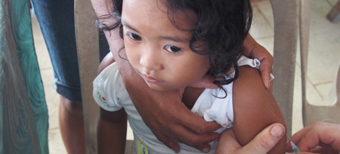 A girl being vaccinated against measles. Photo: UNICEF/Heather Papowitz