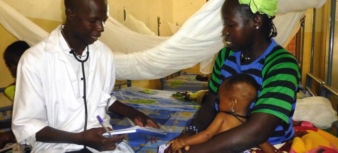 At a health facility in Ségou, central Mali, a mother and her child are examined for signs of malnutrition.