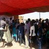 South Sudanese queue to be registered for ID cards, with which they will be able to access many rights.