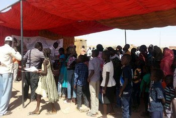 South Sudanese queue to be registered for ID cards, with which they will be able to access many rights.