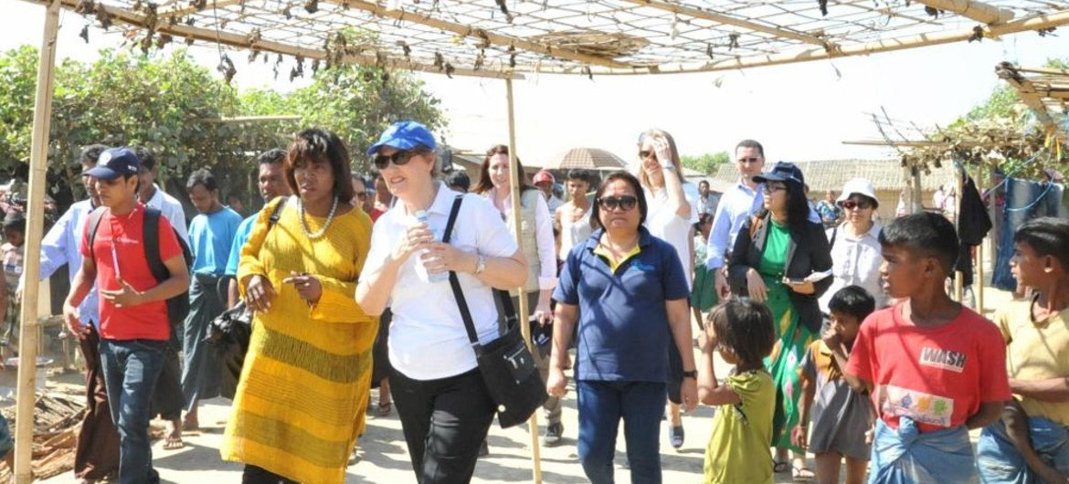 UNDP Administrator Helen Clark (wearing blue cap) and WFP Executive Director Ertharin Cousin (wearing yellow) visit the Thet Kae Pyin settlement for internally displaced people in Sittwe, Rakhine State, Myanmar.