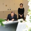Secretary-General Ban Ki-moon signs a book of condolences on the passing of Lee Kuan Yew, the first Prime Minister of Singapore, at the country’s Permanent Mission to the UN. Ambassador Karen Tan of Singapore looks on.