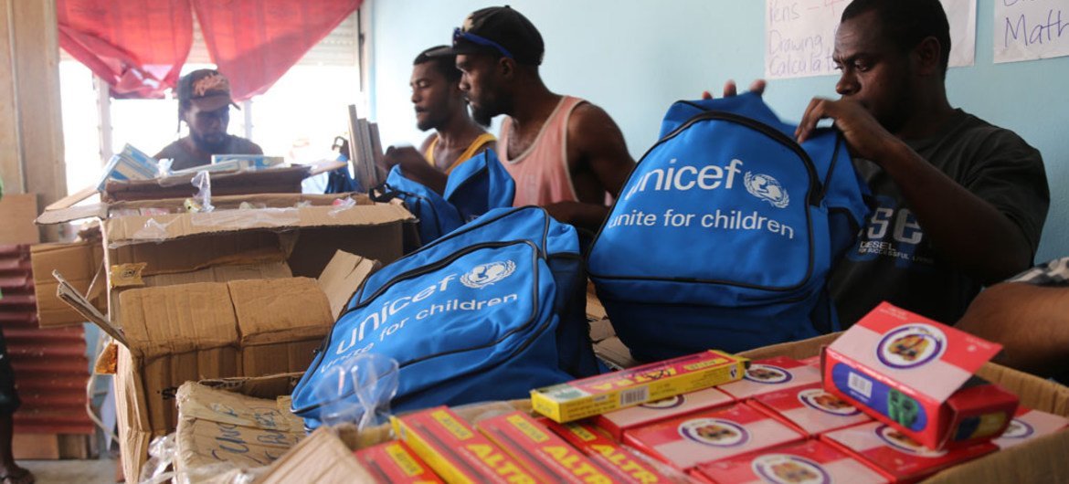 UNICEF staff and community volunteers in Port Vila, Vanuatu pack school kits with essential school supplies for children who lost everything in Cyclone Pam.